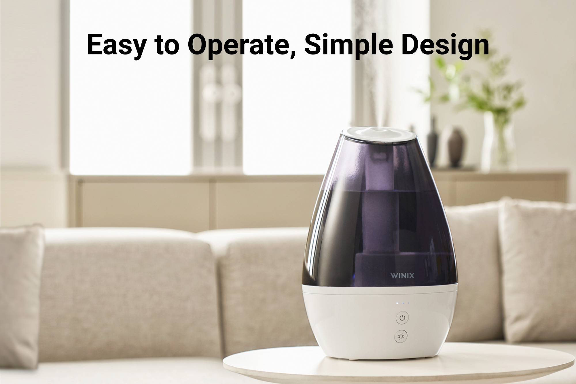 L100 humidifier on coffee table and text saying easy to operate, simple design